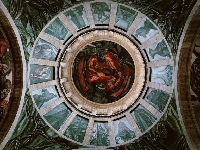 Stunning view of an ornate dome ceiling adorned with intricate frescoes and art.