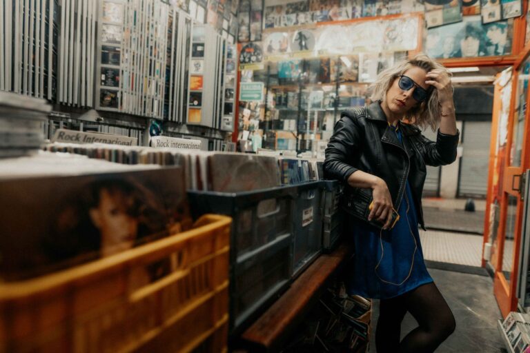 Stylish woman browsing vinyl records in a Buenos Aires music shop, exuding urban cool.