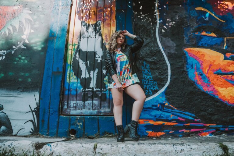 Stylish woman in colorful graffiti setting, perfect for urban fashion themes.