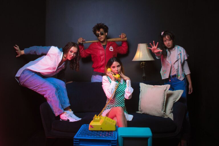 A stylish group portrait with a retro theme captured indoors.