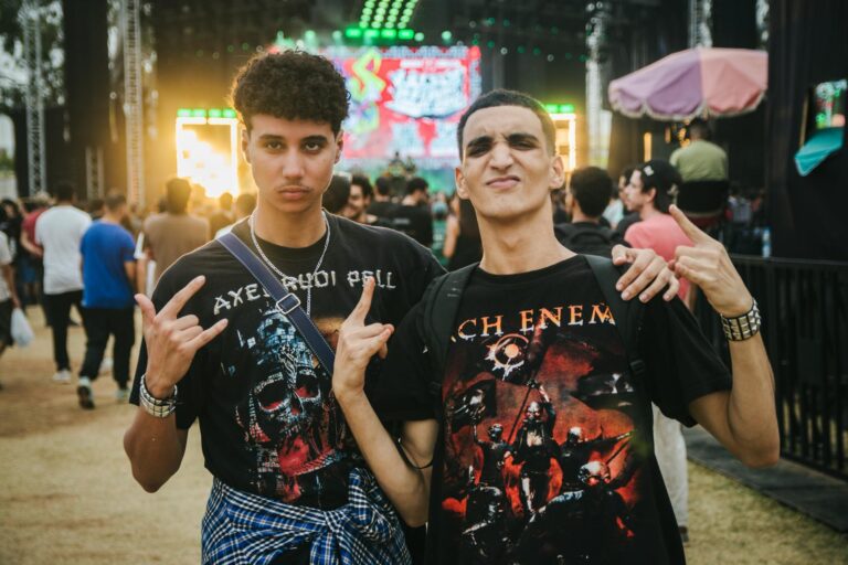 Two young adults enjoying a lively music festival in Casablanca, Morocco.