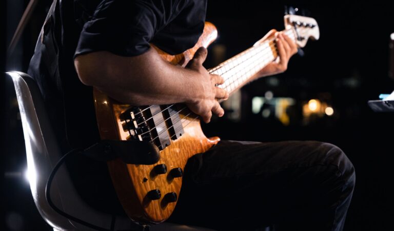 Dynamic close-up of a guitarist performing live on stage in Cervia, Italy.